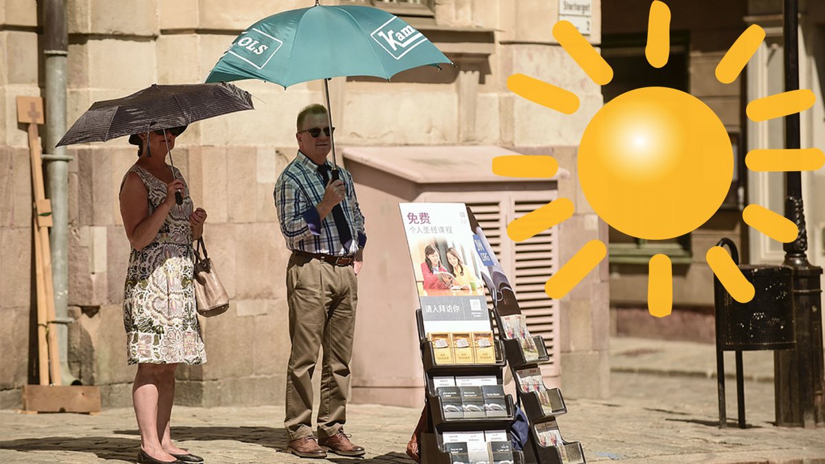 två människor, paraply, sol